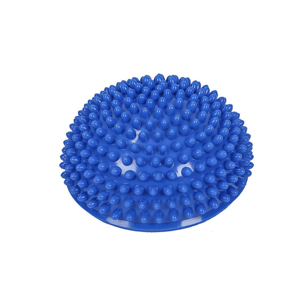 Spiky half-dome balance and massage ball on floor